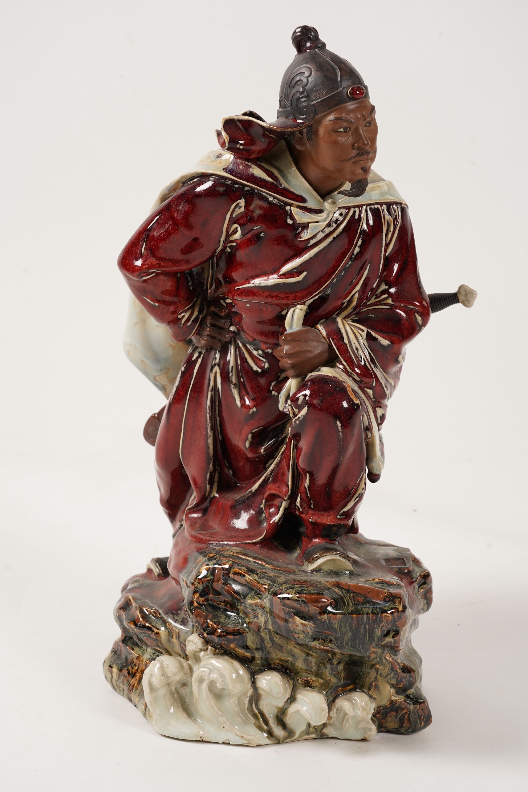 A large Chinese Shiwan stoneware figure of a warrior, 20th century